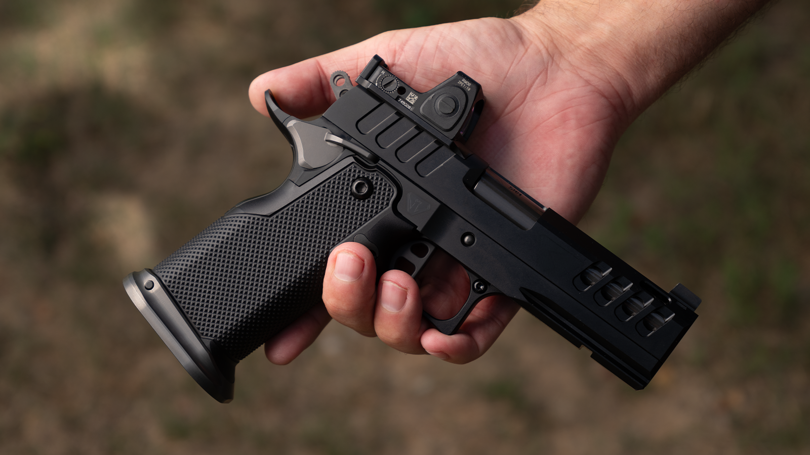 Watchtower Defense Vaelon C double-stack 1911 in hand
