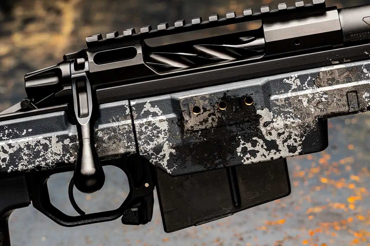 Watchtower Defense Stratis Bravo bolt-action rifle, close-up of an AICS-pattern magazine, mag release and spiral-fluted bolt
