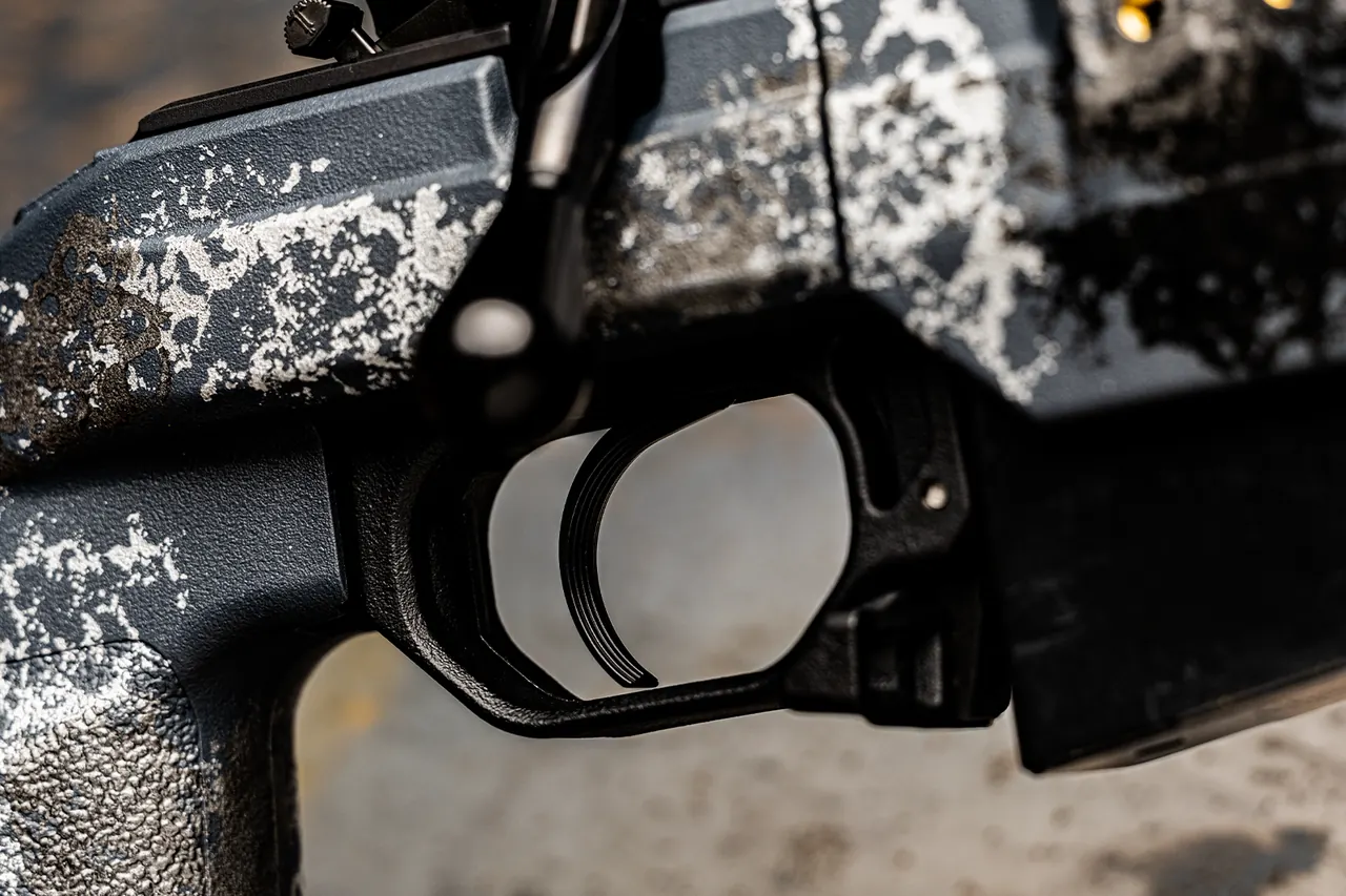 Watchtower Defense Stratis Bravo bolt-action rifle, close-up of the TriggerTech trigger in the hand-painted Moonlight Camo chassis