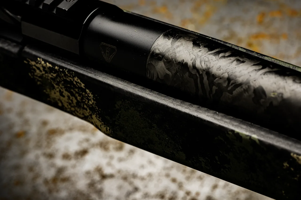 Watchtower Defense Stratis bolt-action rifle, close-up of the Proof Research carbon fiber barrel where it leaves the receiver