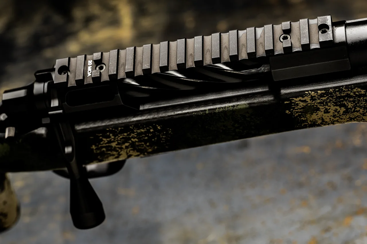 Watchtower Defense Stratis bolt-action rifle, close-up of the pinned 20 MOA rail over the spiral-fluted bolt