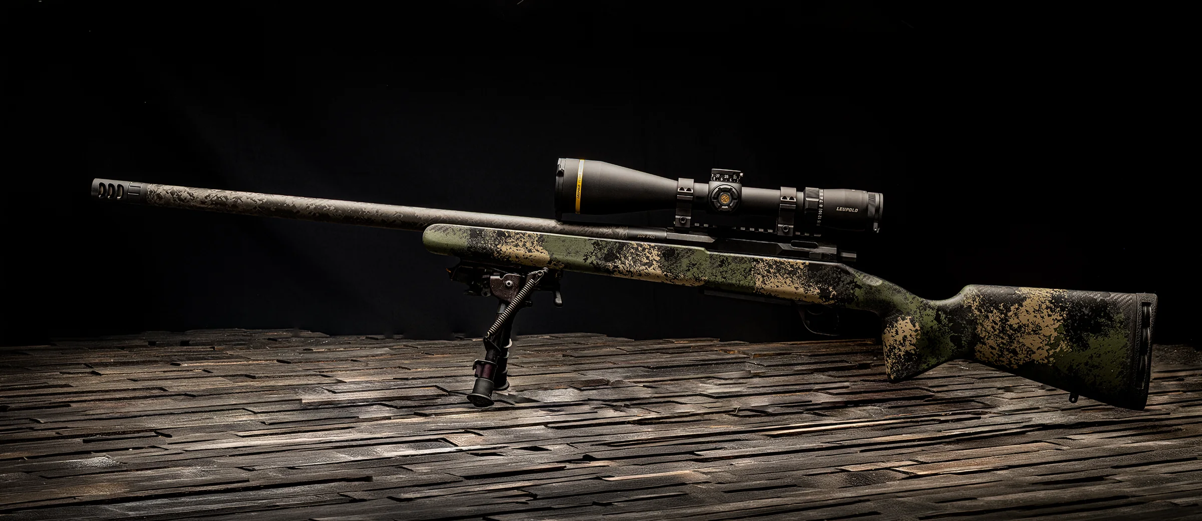 Watchtower Defense Stratis bolt-action rifle in Tropic Thunder Camo, hand-painted carbon fiber stock, with scope and bipod