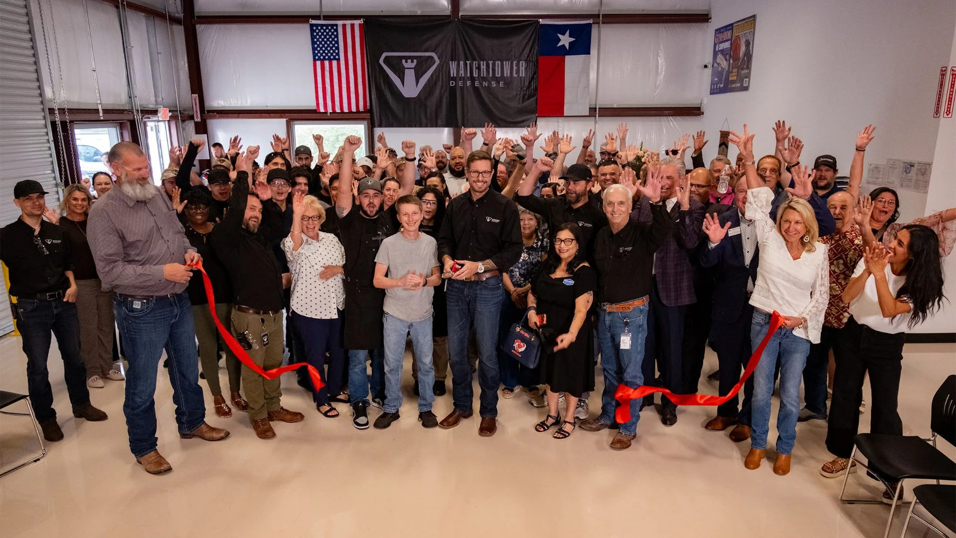Watchtower Defense team and guests celebrate the grand opening ribbon cutting in Tomball, Texas