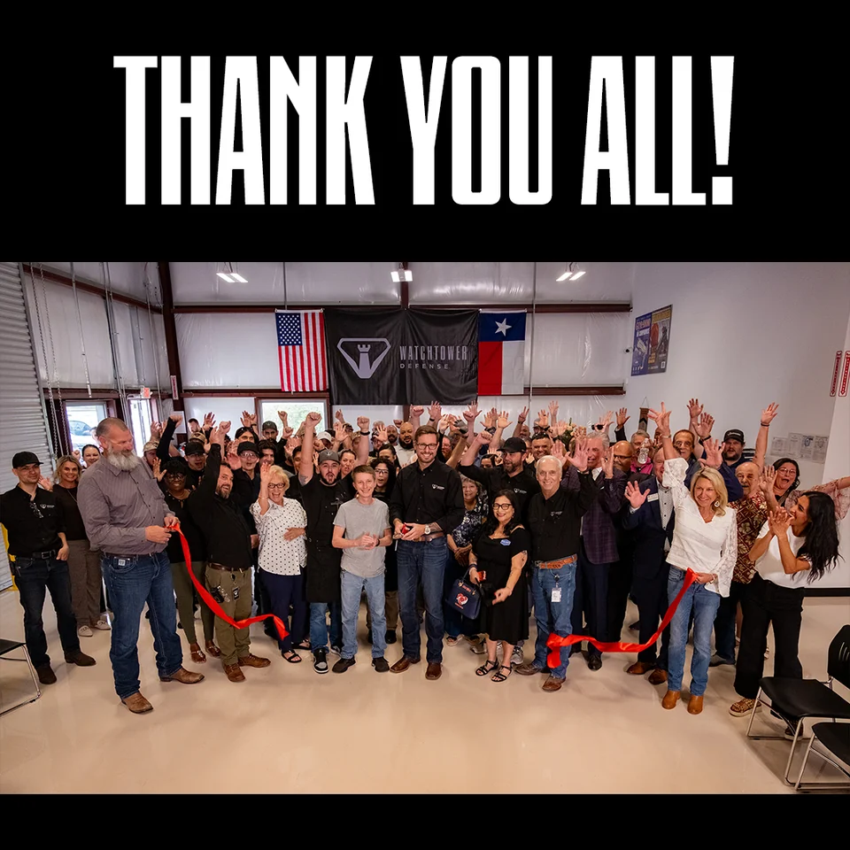 Watchtower Defense team and guests celebrate the grand opening ribbon cutting in Tomball, Texas